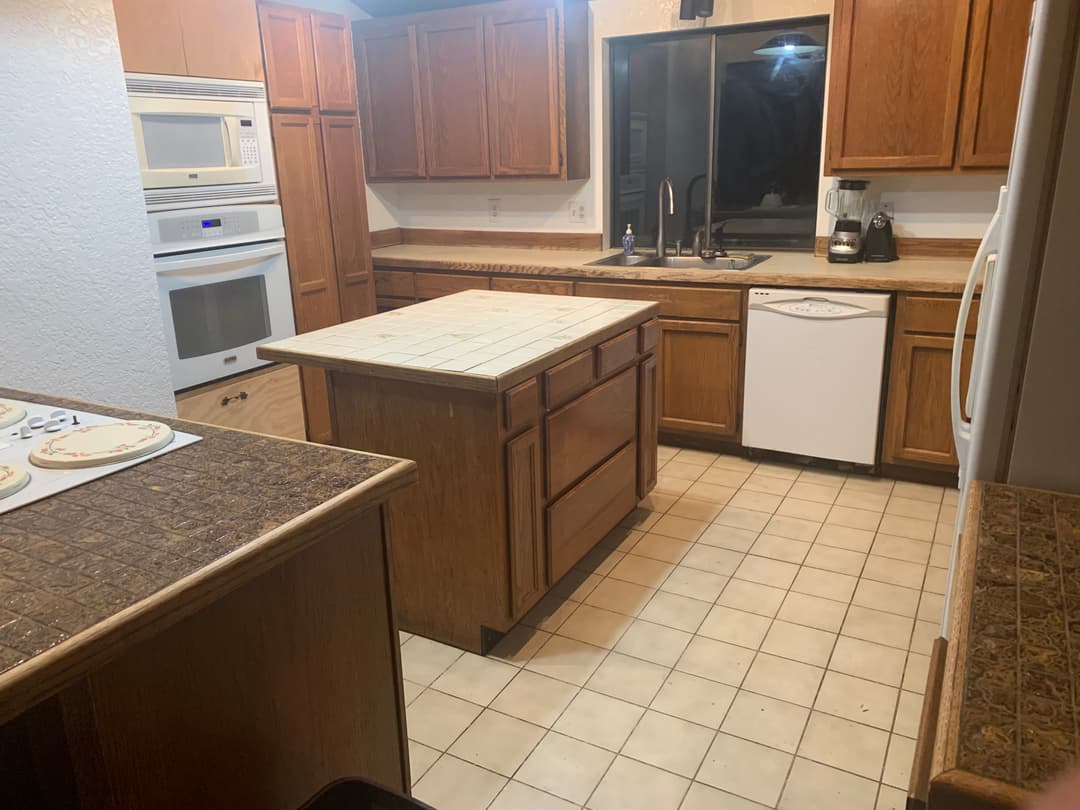 picture of an updated kitchen with a newly remodeled island and countertop
